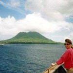 Kim on bow of ship near St. Eustatius in Carribbean