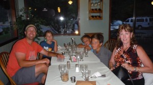 Kim with Mark and his children at River Dance Lodge Dining